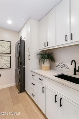 Interior, Kitchen, Recessed Lighting, Washer, Wood Texture Flooring