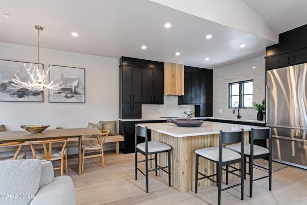 Dining room, Interior, Kitchen, Marble Walls, Pendant Lights, Recessed Lighting, Stainless Steel Appliances, Wood Texture Flooring