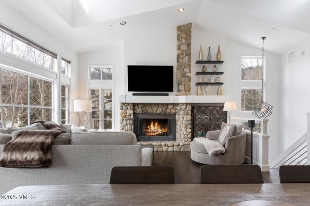 Fireplace, Interior, Living room, Recessed Lighting, Stone Walls, Wood Texture Flooring