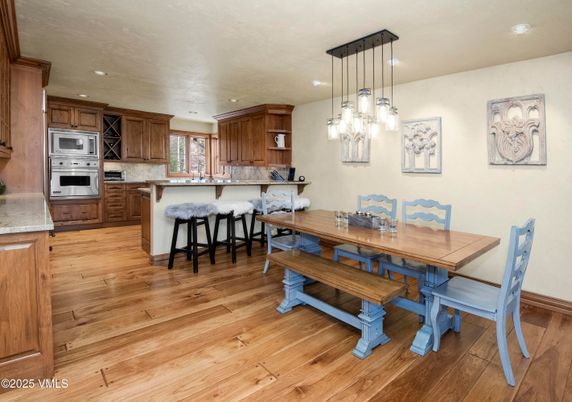 Dining room, Interior, Kitchen, Pendant Lights, Recessed Lighting, Stainless Steel Appliances, Wood Texture Flooring