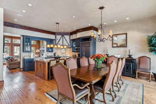 Chandelier, Dining room, Interior, Kitchen, Pendant Lights, Recessed Lighting, Stainless Steel Appliances, Wood Texture Flooring