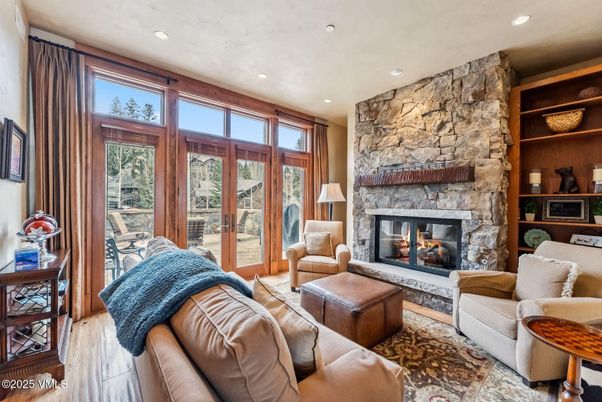 Fireplace, Interior, Living room, Recessed Lighting, Stone Walls, Wood Texture Flooring
