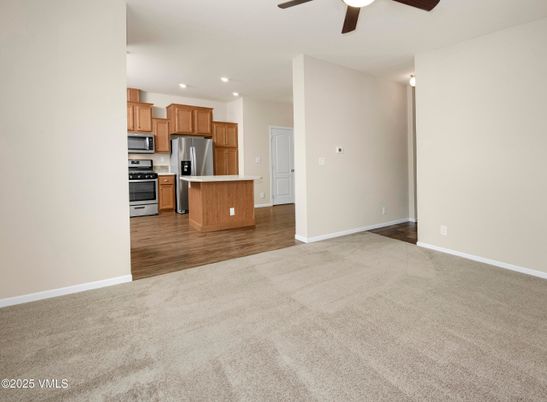 Empty room, Interior, Kitchen, Recessed Lighting, Stainless Steel Appliances, Wood Texture Flooring