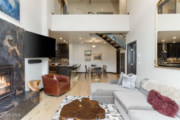 Dining room, Fireplace, Interior, Living room, Pendant Lights, Recessed Lighting, Wood Texture Flooring