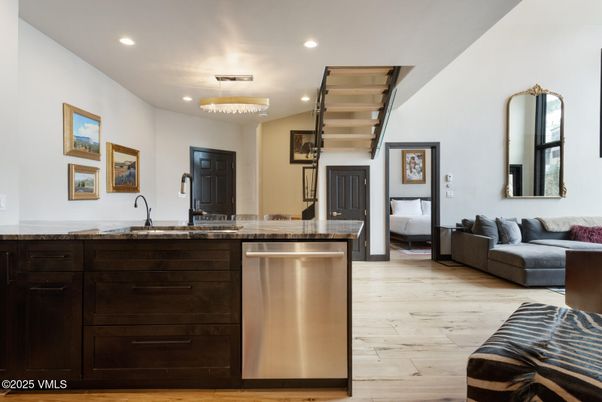 Chandelier, Interior, Kitchen, Living room, Recessed Lighting, Stainless Steel Appliances, Wood Texture Flooring
