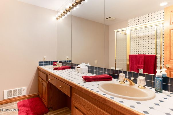 Bathroom, Dual Sink Vanities, Glass Shower, Interior, Recessed Lighting, Tile Countertops