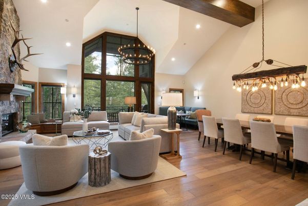 Chandelier, Dining room, Fireplace, Interior, Living room, Pendant Lights, Recessed Lighting, Wooden Beams, Wood Texture Flooring