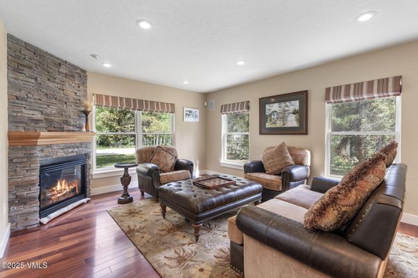 Fireplace, Interior, Living room, Recessed Lighting, Stone Walls, Wood Texture Flooring