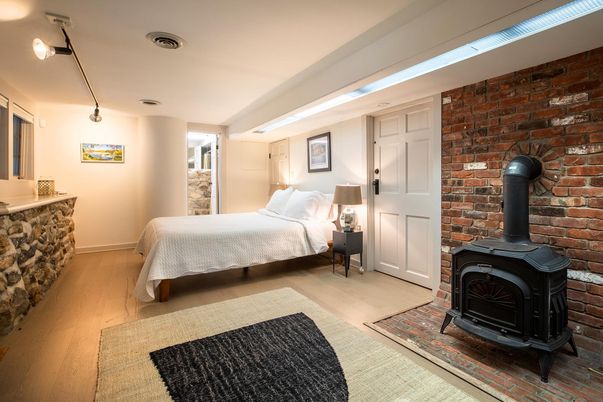 Bedroom, Fireplace, Interior, Stone Walls, Wood Texture Flooring