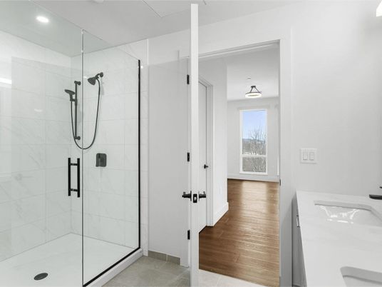 Bathroom, Glass Shower, Interior, Marble Walls, Recessed Lighting, Wood Texture Flooring