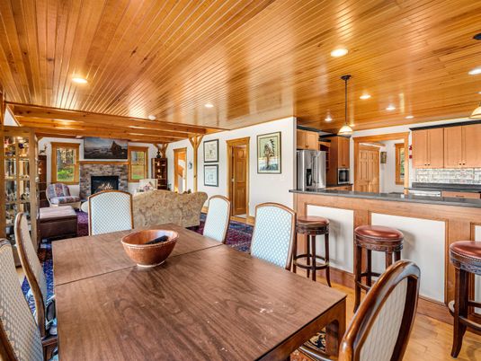 Dining room, Fireplace, Interior, Kitchen, Living room, Pendant Lights, Recessed Lighting, Stainless Steel Appliances, Wooden Ceilings, Wood Texture Flooring
