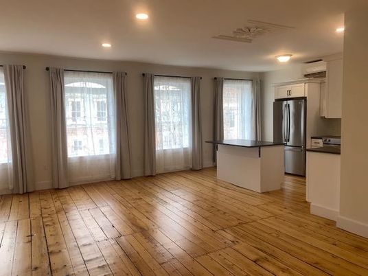 Empty room, Interior, Kitchen, Recessed Lighting, Stainless Steel Appliances, Wood Texture Flooring