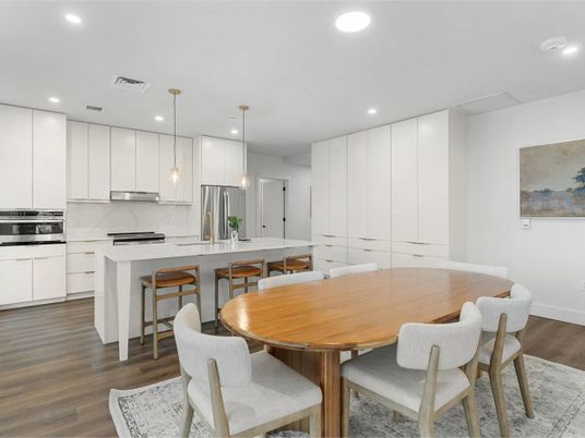 Dining room, Interior, Kitchen, Pendant Lights, Recessed Lighting, Stainless Steel Appliances, Wood Texture Flooring