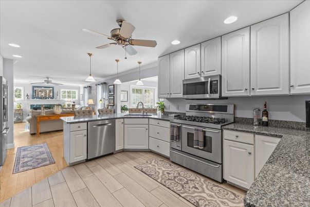 Dining room, Interior, Kitchen, Pendant Lights, Recessed Lighting, Stainless Steel Appliances, Wood Texture Flooring