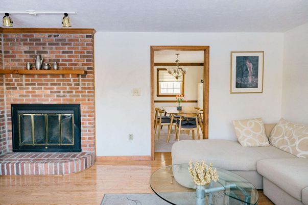 Chandelier, Dining room, Fireplace, Interior, Living room, Stone Walls, Wood Texture Flooring