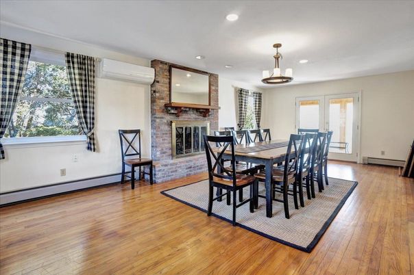 Dining room, Fireplace, Interior, Recessed Lighting, Stone Walls, Wood Texture Flooring