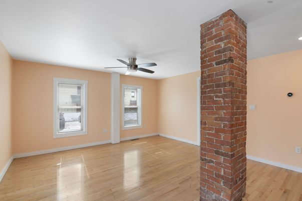 Empty room, Fireplace, Interior, Recessed Lighting, Stone Walls, Wood Texture Flooring
