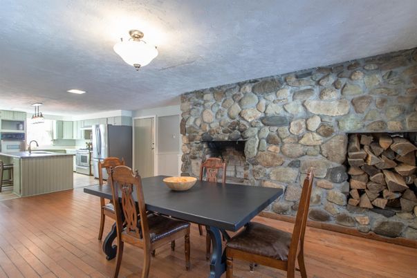 Dining room, Fireplace, Interior, Kitchen, Pendant Lights, Stone Walls, Wood Texture Flooring