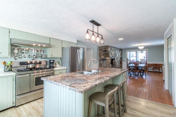 Dining room, Interior, Kitchen, Pendant Lights, Recessed Lighting, Stainless Steel Appliances, Stone Walls, Wood Texture Flooring