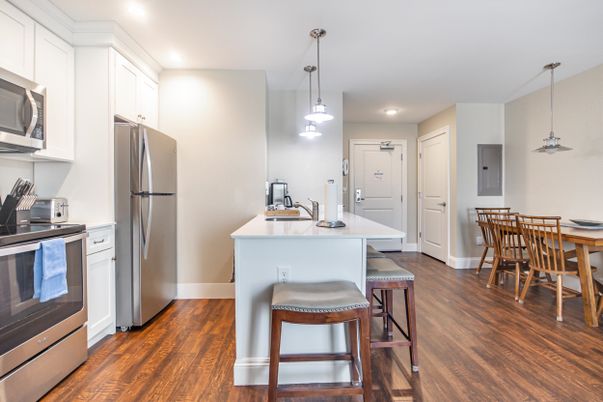 Dining room, Interior, Kitchen, Pendant Lights, Recessed Lighting, Stainless Steel Appliances, Wood Texture Flooring