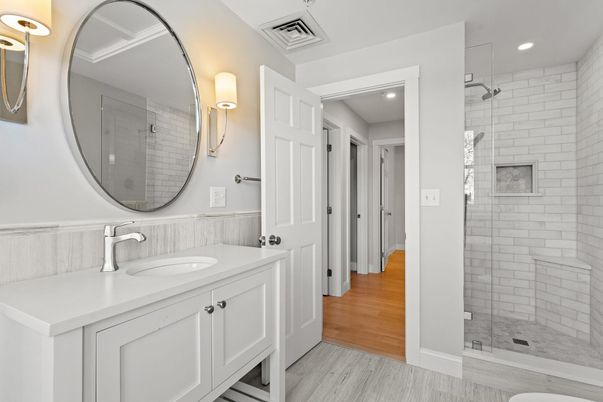 Bathroom, Dual Sink Vanities, Glass Shower, Interior, Recessed Lighting, Wood Texture Flooring