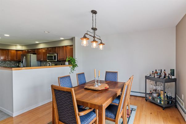 Dining room, Interior, Kitchen, Pendant Lights, Recessed Lighting, Stainless Steel Appliances, Wood Texture Flooring