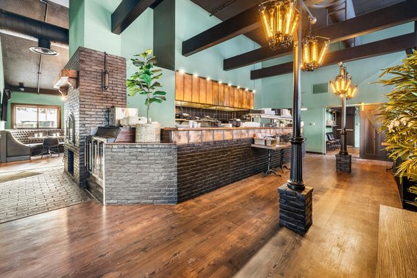 Chandelier, Dining room, Interior, Kitchen, Pendant Lights, Stainless Steel Appliances, Stone Walls, Wooden Beams, Wood Texture Flooring