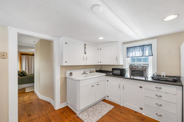 Interior, Kitchen, Recessed Lighting, Washer, Wood Texture Flooring