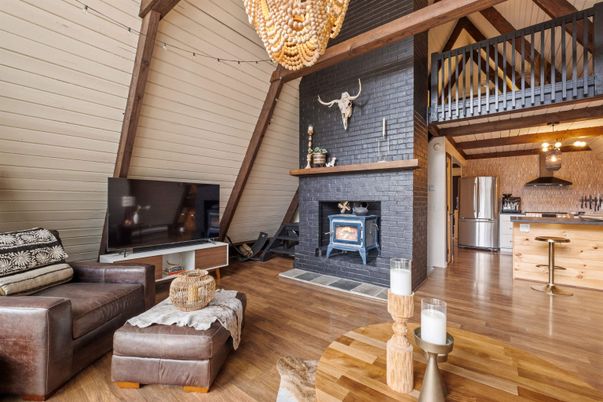 Chandelier, Fireplace, Interior, Kitchen, Living room, Stainless Steel Appliances, Wood Texture Flooring
