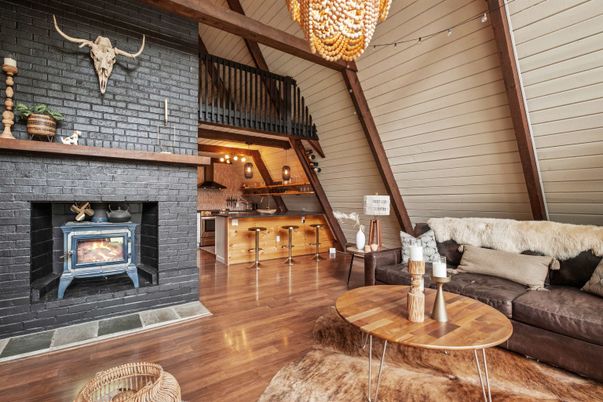 Chandelier, Fireplace, Interior, Living room, Pendant Lights, Stone Walls, Wooden Beams, Wood Texture Flooring