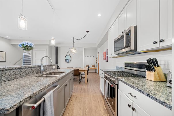 Dining room, Interior, Kitchen, Pendant Lights, Recessed Lighting, Stainless Steel Appliances, Wood Texture Flooring