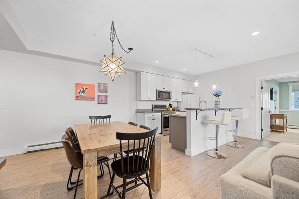 Dining room, Interior, Kitchen, Pendant Lights, Recessed Lighting, Stainless Steel Appliances, Wood Texture Flooring