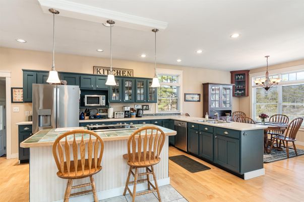 Chandelier, Dining room, Interior, Kitchen, Pendant Lights, Recessed Lighting, Stainless Steel Appliances, Wood Texture Flooring