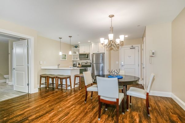 Chandelier, Dining room, Interior, Kitchen, Pendant Lights, Recessed Lighting, Stainless Steel Appliances, Wood Texture Flooring