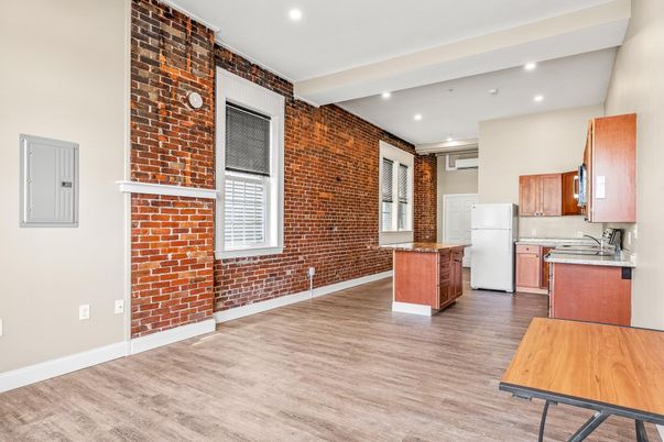 Interior, Kitchen, Recessed Lighting, Stone Walls, Washer, Wood Texture Flooring