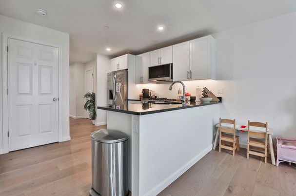 Dining room, Interior, Kitchen, Recessed Lighting, Stainless Steel Appliances, Wood Texture Flooring