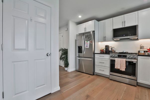 Interior, Kitchen, Recessed Lighting, Stainless Steel Appliances, Wood Texture Flooring