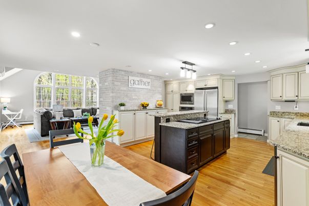 Dining room, Interior, Kitchen, Living room, Recessed Lighting, Stainless Steel Appliances, Stone Walls, Wood Texture Flooring