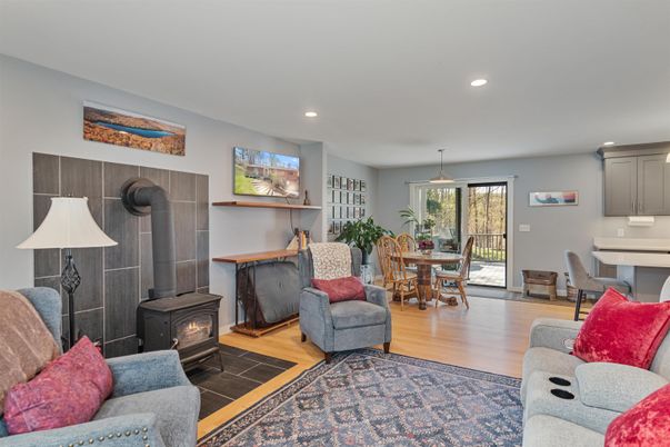 Dining room, Fireplace, Interior, Living room, Recessed Lighting, Wood Texture Flooring
