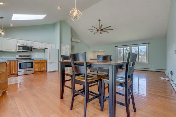 Dining room, Interior, Kitchen, Pendant Lights, Recessed Lighting, Stainless Steel Appliances, Wood Texture Flooring