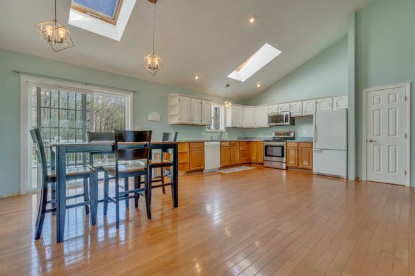 Chandelier, Dining room, Interior, Kitchen, Pendant Lights, Recessed Lighting, Stainless Steel Appliances, Wood Texture Flooring