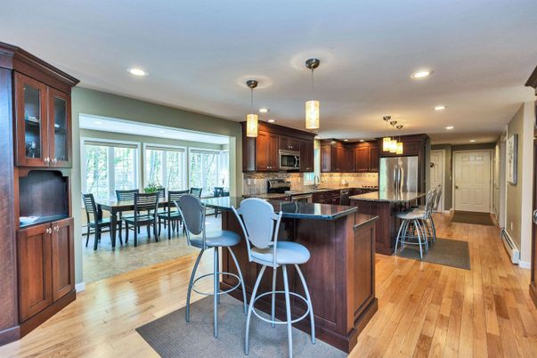 Dining room, Interior, Kitchen, Pendant Lights, Recessed Lighting, Stainless Steel Appliances, Wood Texture Flooring