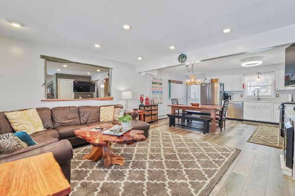 Chandelier, Dining room, Interior, Kitchen, Living room, Pendant Lights, Recessed Lighting, Stainless Steel Appliances, Wood Texture Flooring