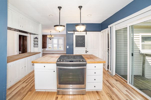 Chandelier, Interior, Kitchen, Pendant Lights, Recessed Lighting, Stainless Steel Appliances, Wood Texture Flooring