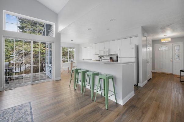 Dining room, Interior, Kitchen, Pendant Lights, Recessed Lighting, Stainless Steel Appliances, Wood Texture Flooring