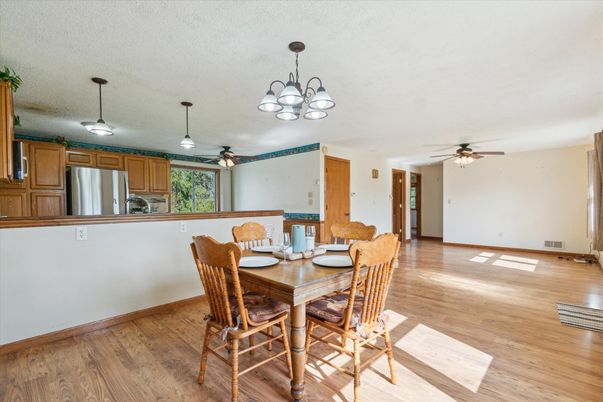 Chandelier, Dining room, Interior, Kitchen, Stainless Steel Appliances, Wood Texture Flooring