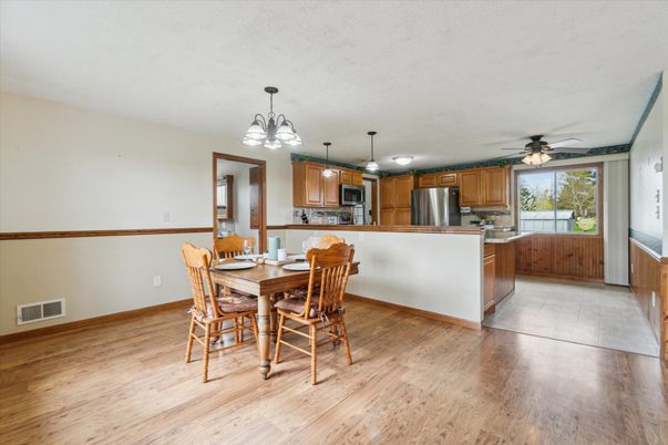 Dining room, Interior, Kitchen, Pendant Lights, Stainless Steel Appliances, Wood Texture Flooring