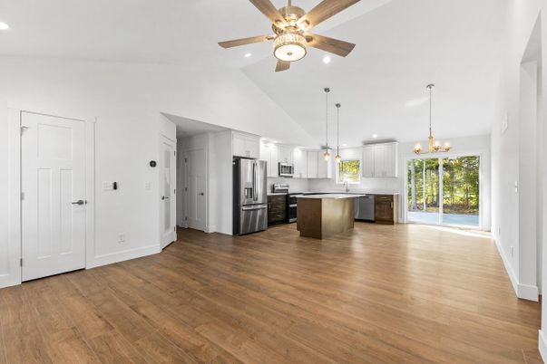Empty room, Interior, Kitchen, Pendant Lights, Recessed Lighting, Stainless Steel Appliances, Wood Texture Flooring