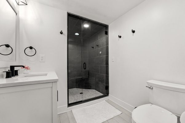 Bathroom, Dual Sink Vanities, Glass Shower, Interior, Recessed Lighting, Wood Texture Flooring