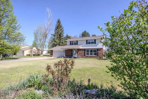 Attached, Backyard, Exterior, Facade, Brick Facade, Split Level